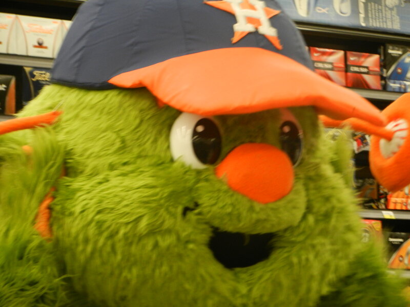 Green Mascot in Cap