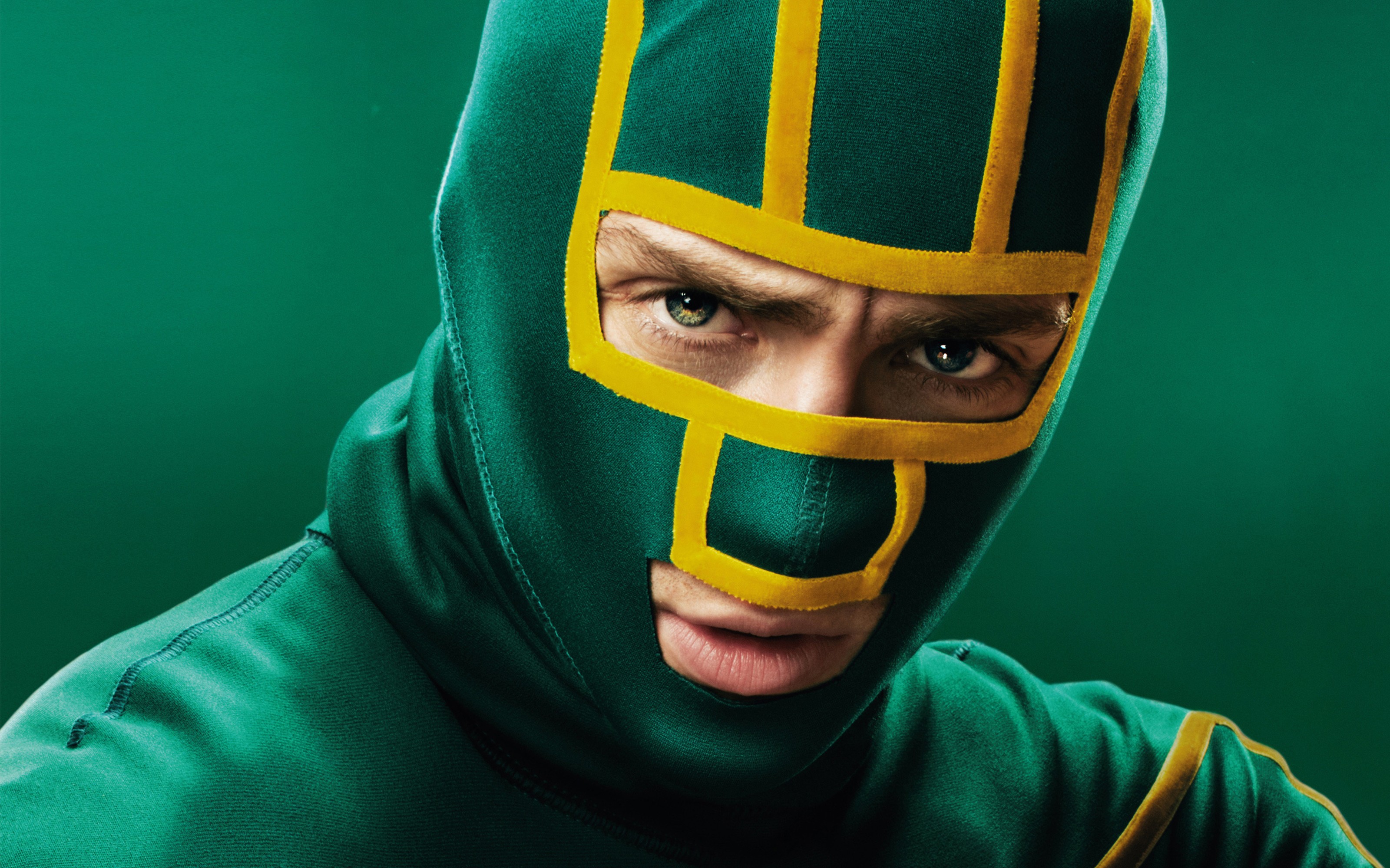green masked character close-up