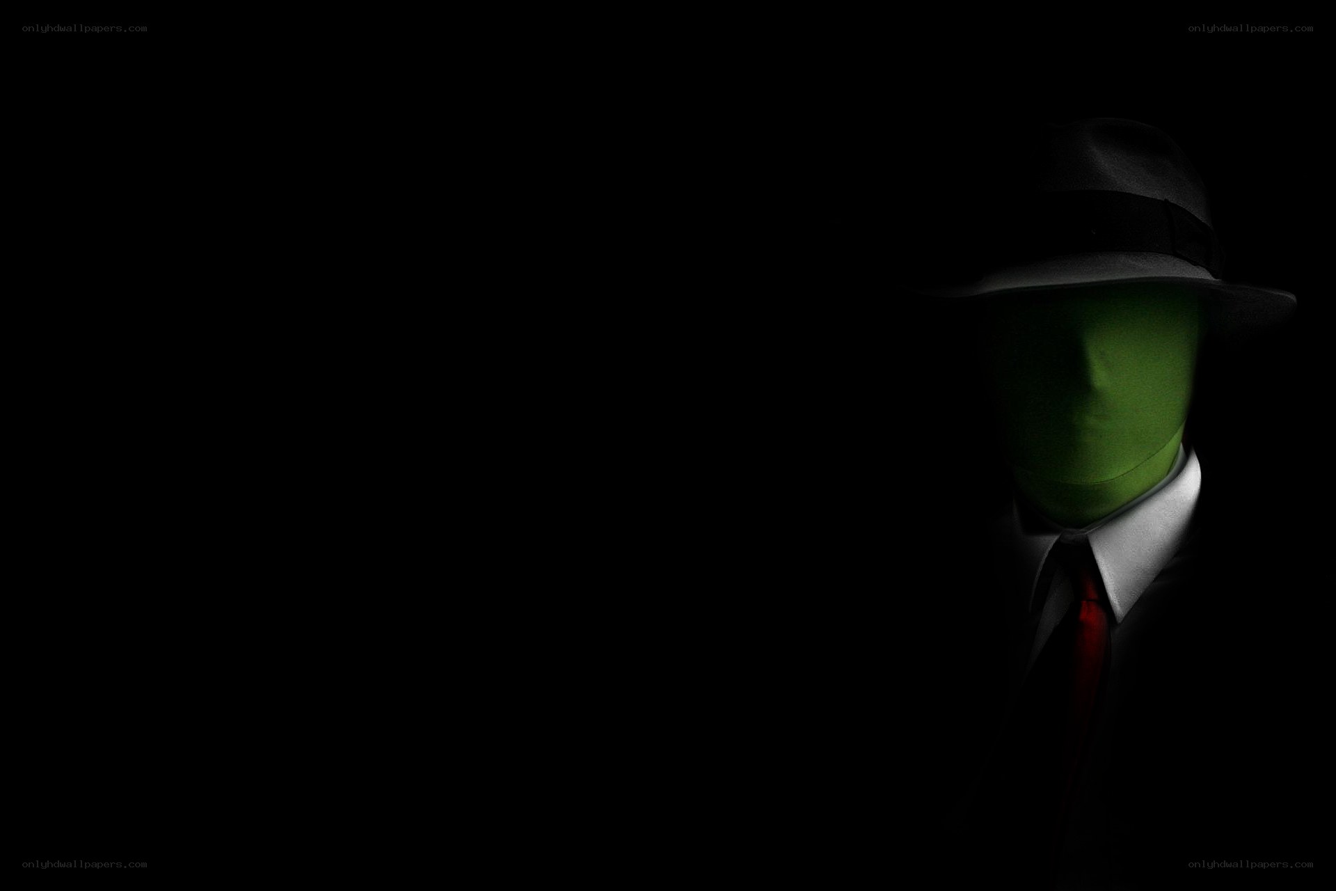 green-masked figure in suit