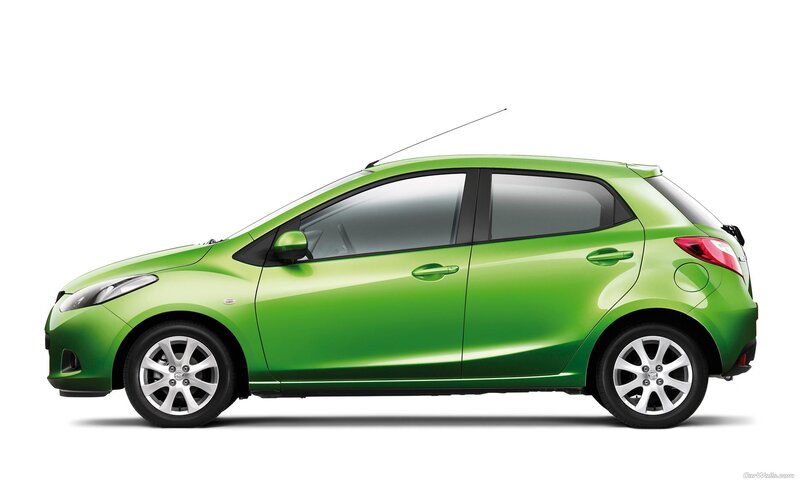 green mazda hatchback car
