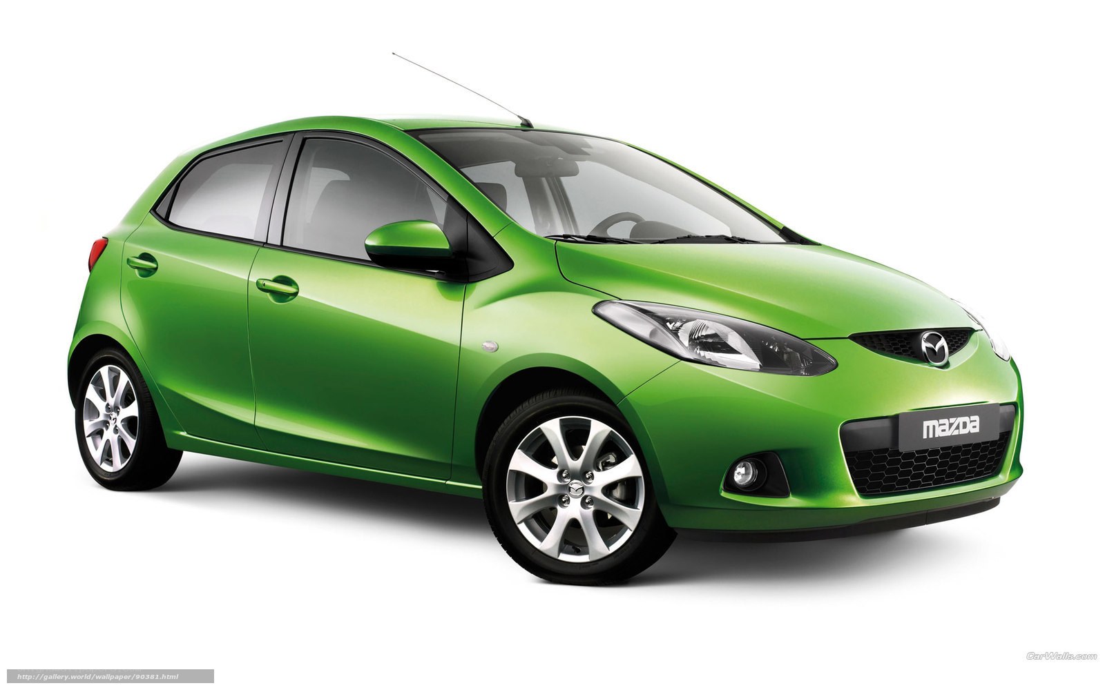 green mazda hatchback car