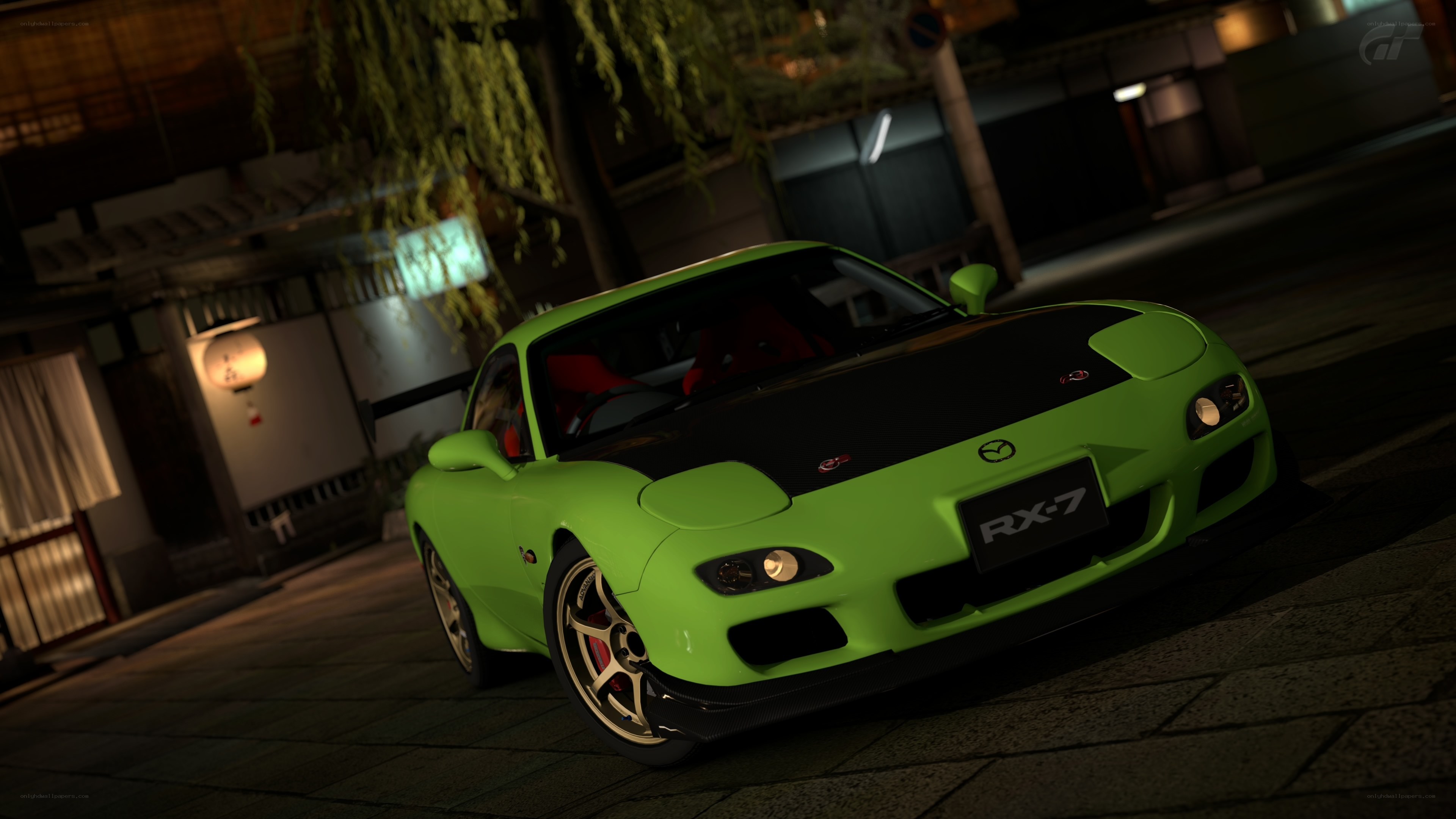 green mazda rx-7 at night