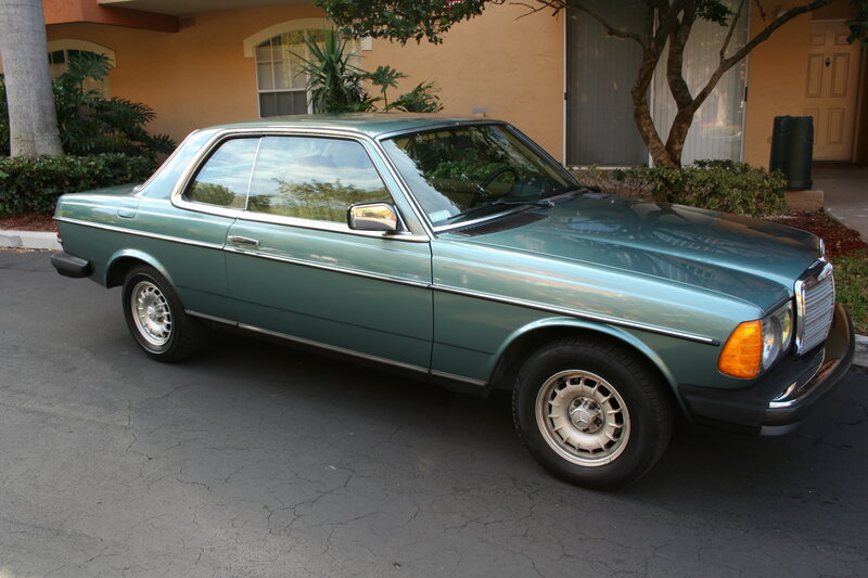 green mercedes coupe parked outside