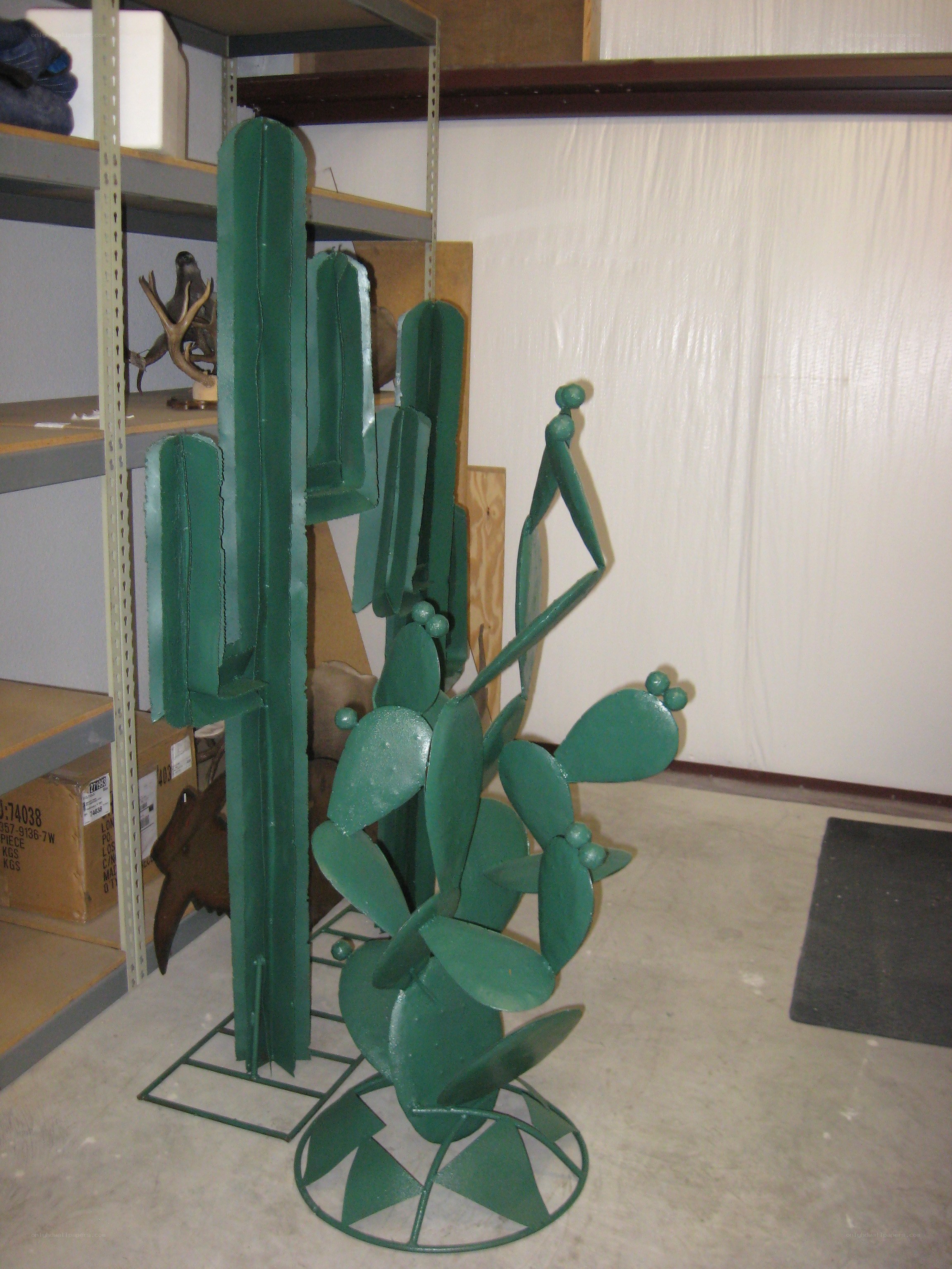 Green metal cactus sculptures