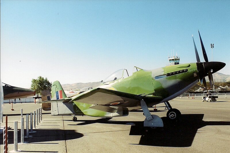 Green Military Airplane — Calm, Afternoon, Photograph, Control Tower