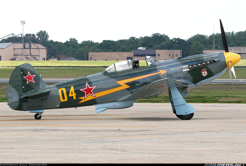 Green Military Airplane — Calm, Afternoon, Photograph