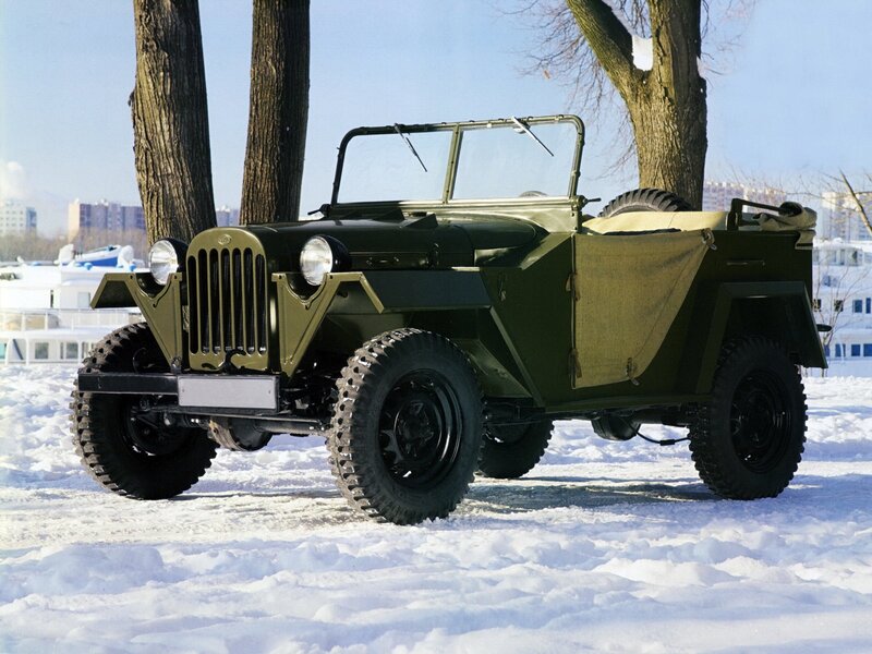 Green military jeep in snow