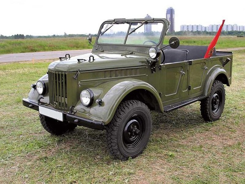 Green military jeep on grass