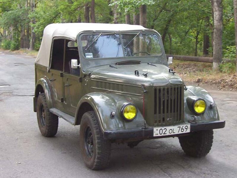 Green military jeep on road