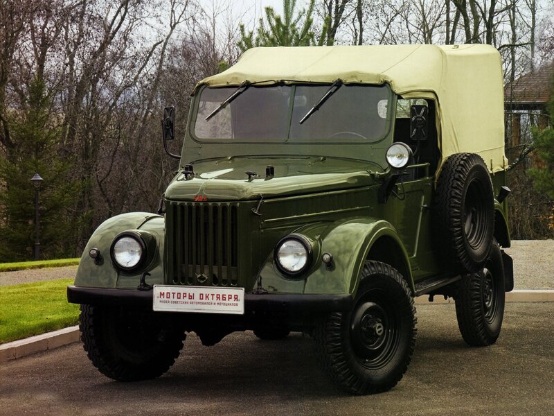 Green military jeep with canvas top