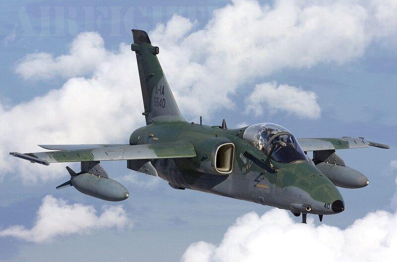 Green military jet in flight
