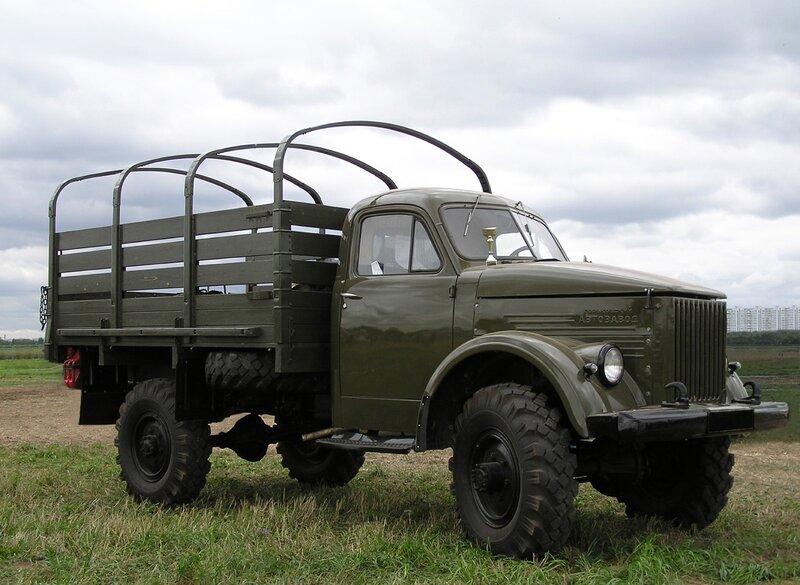 Green military truck in field