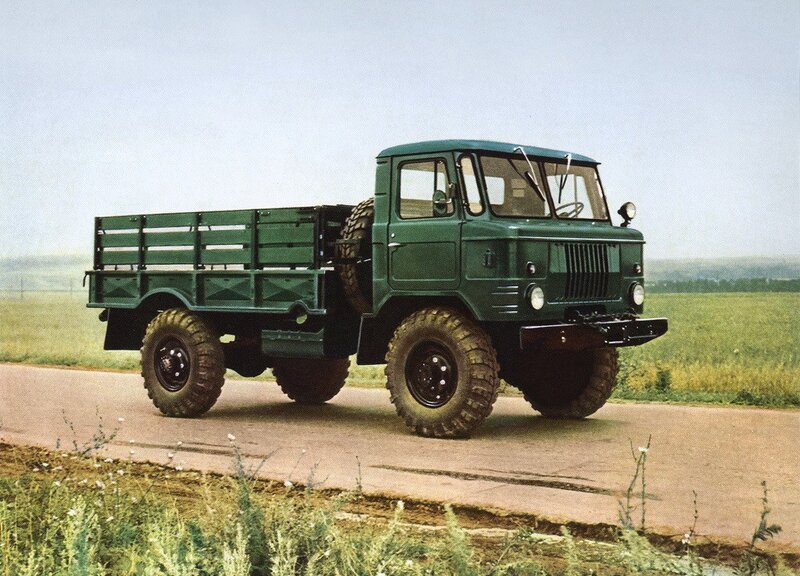 Green military truck on road