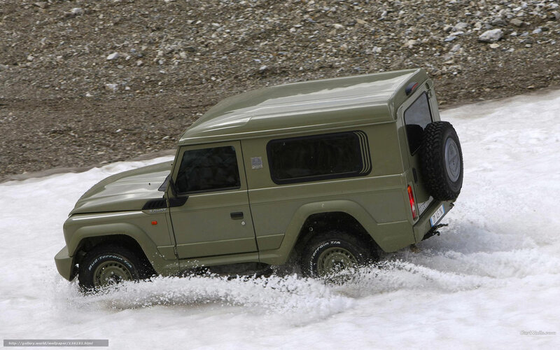 green military vehicle on snow