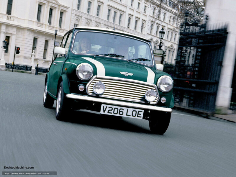 Green Mini Cooper on city street