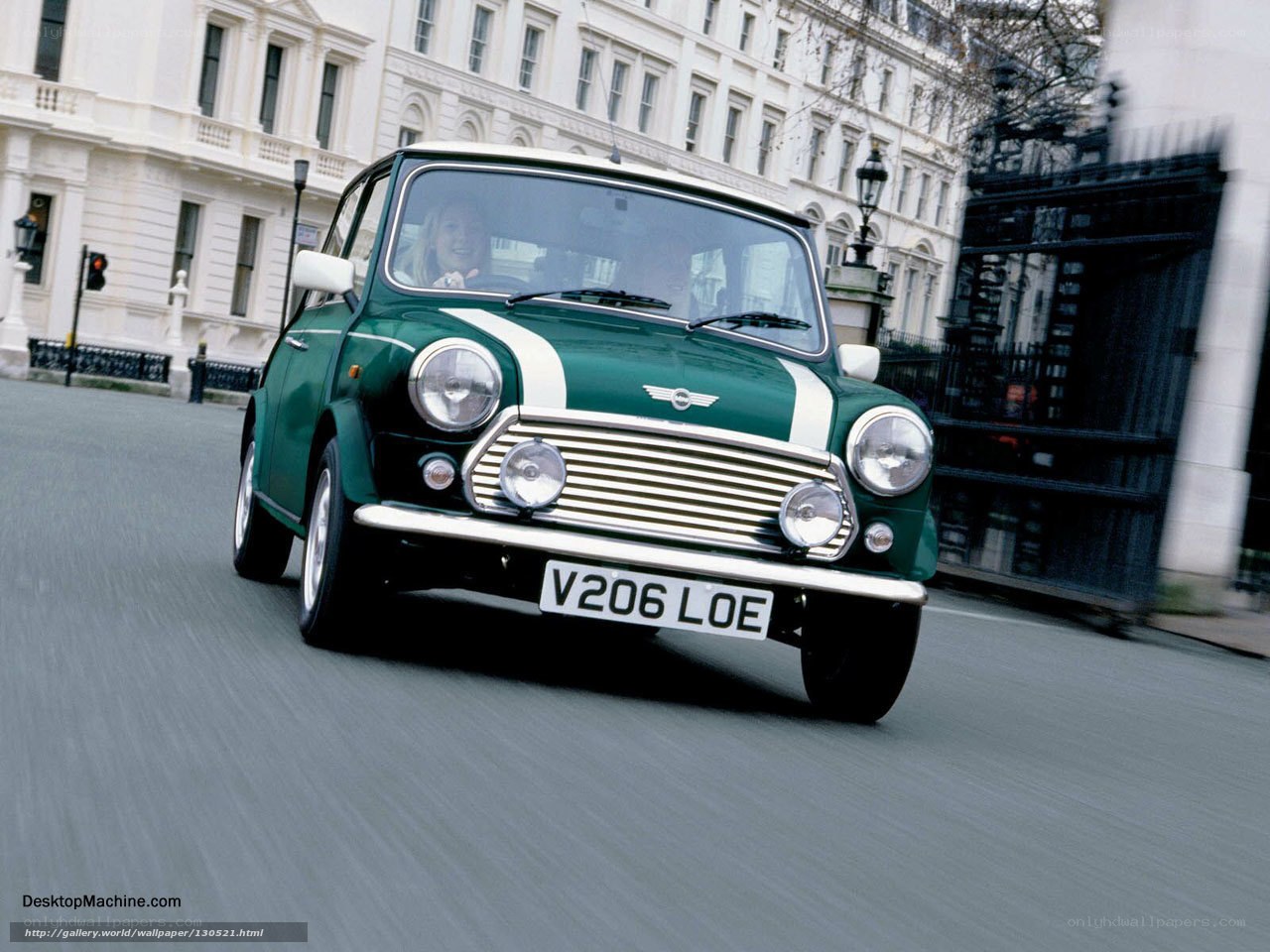 Green Mini Cooper on city street