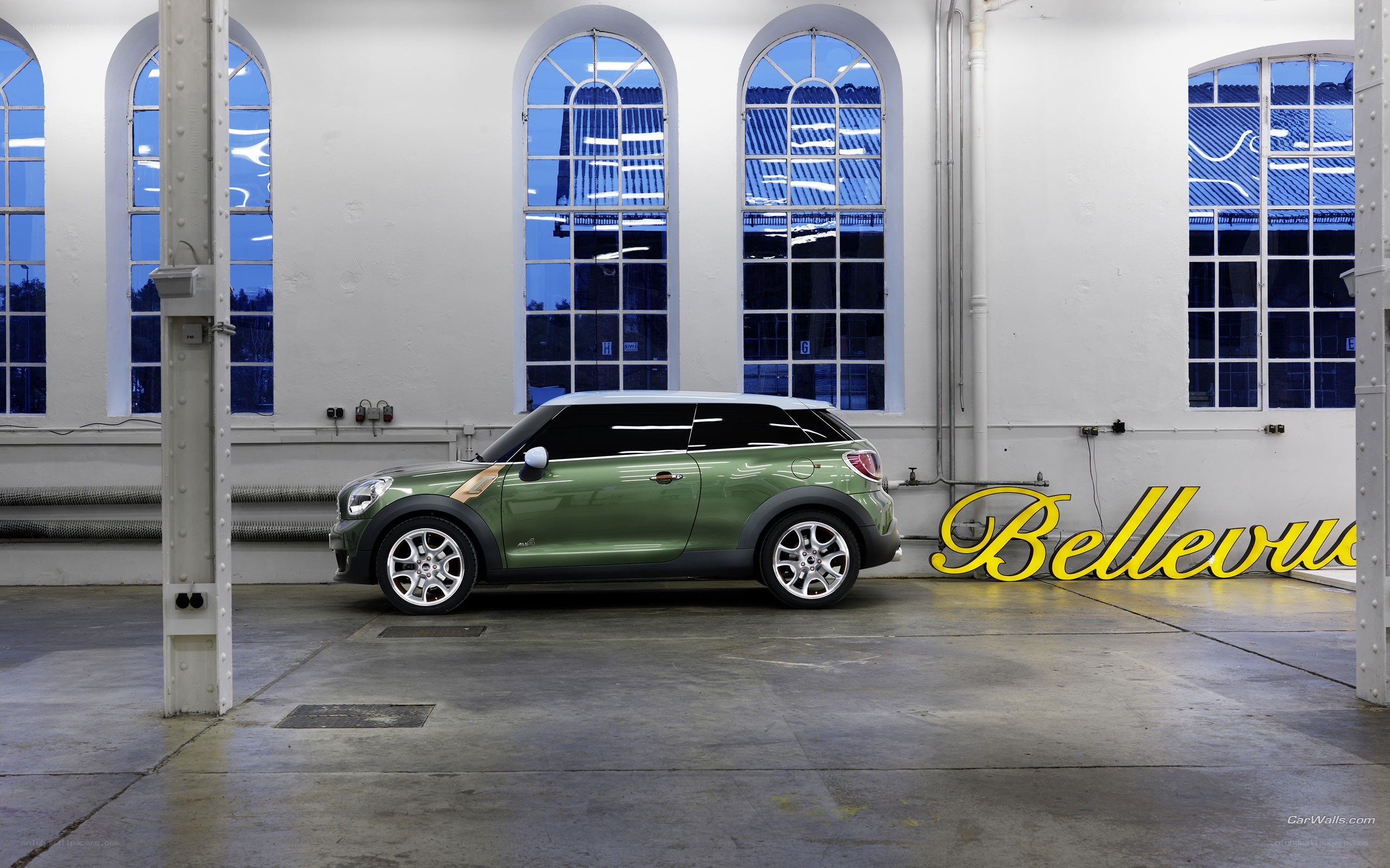 Green MINI Countryman in a warehouse