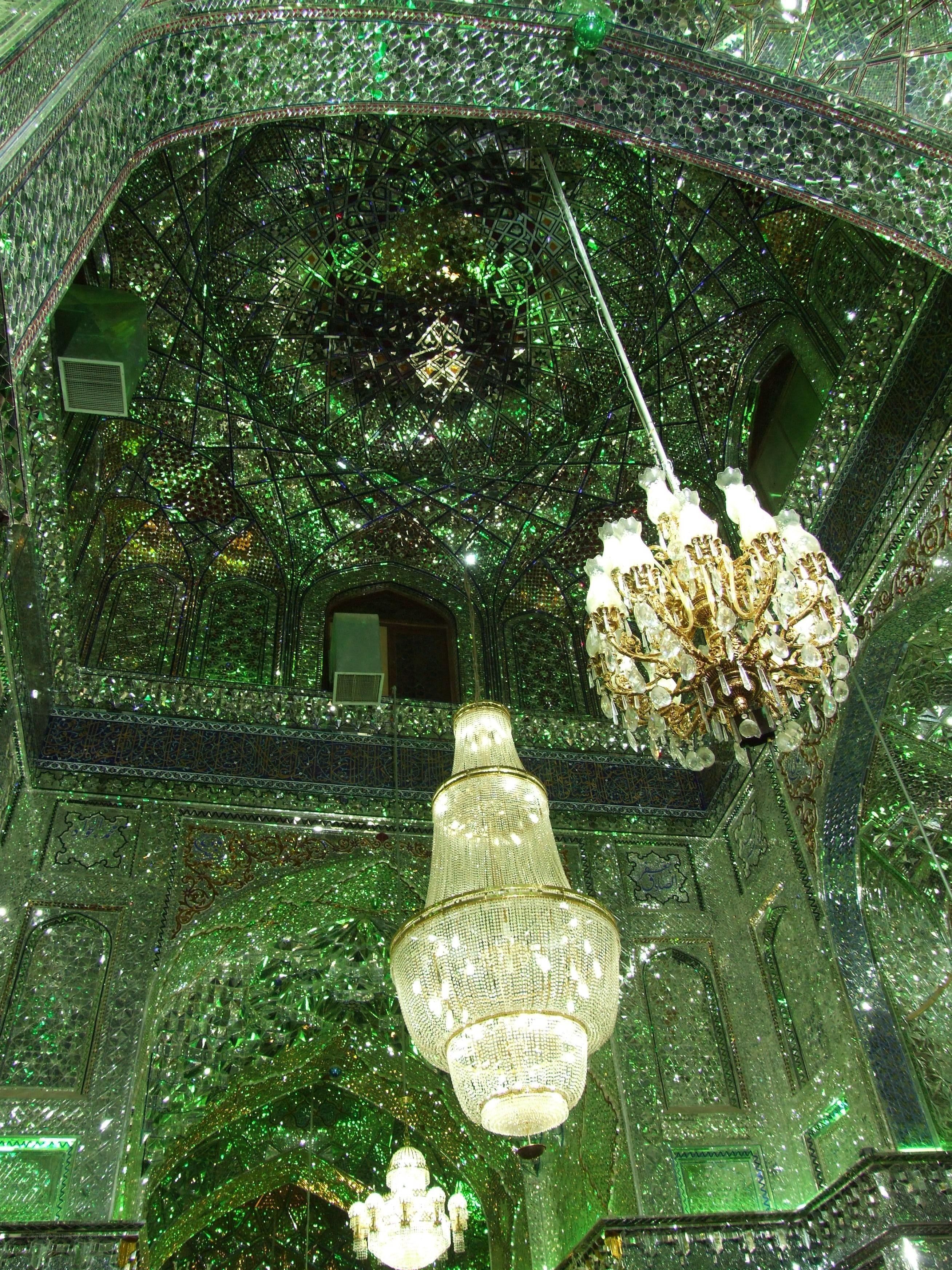 Green mirror hall with chandeliers