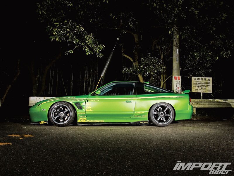 green modified car at night