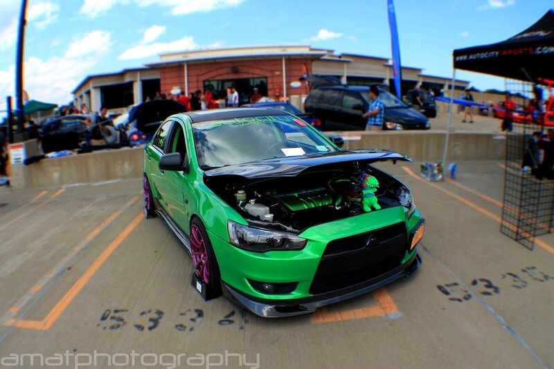 green modified car at show