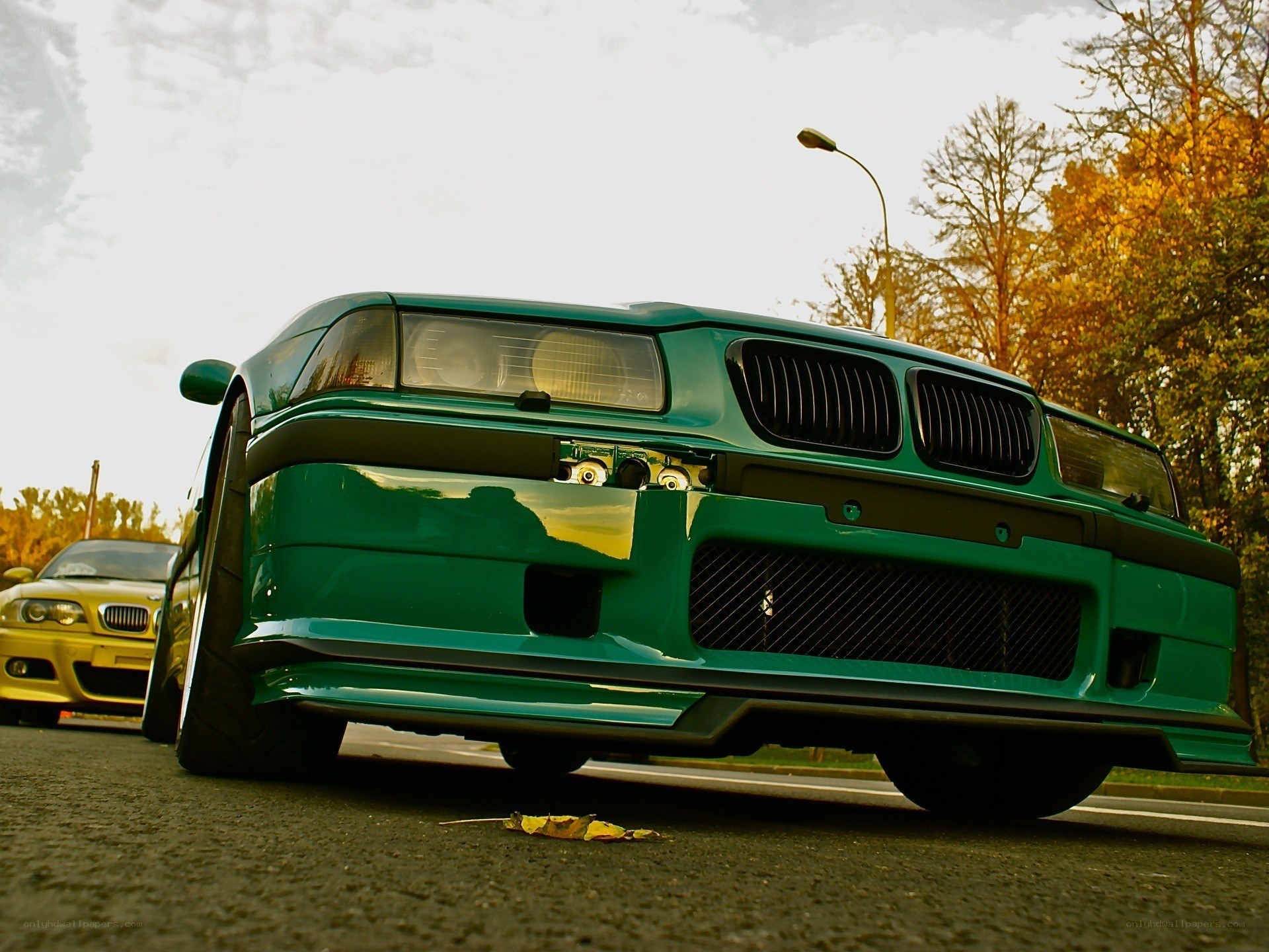 Green modified car on street