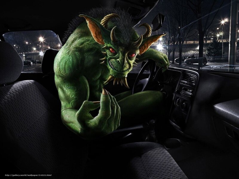 Green monster in car at night