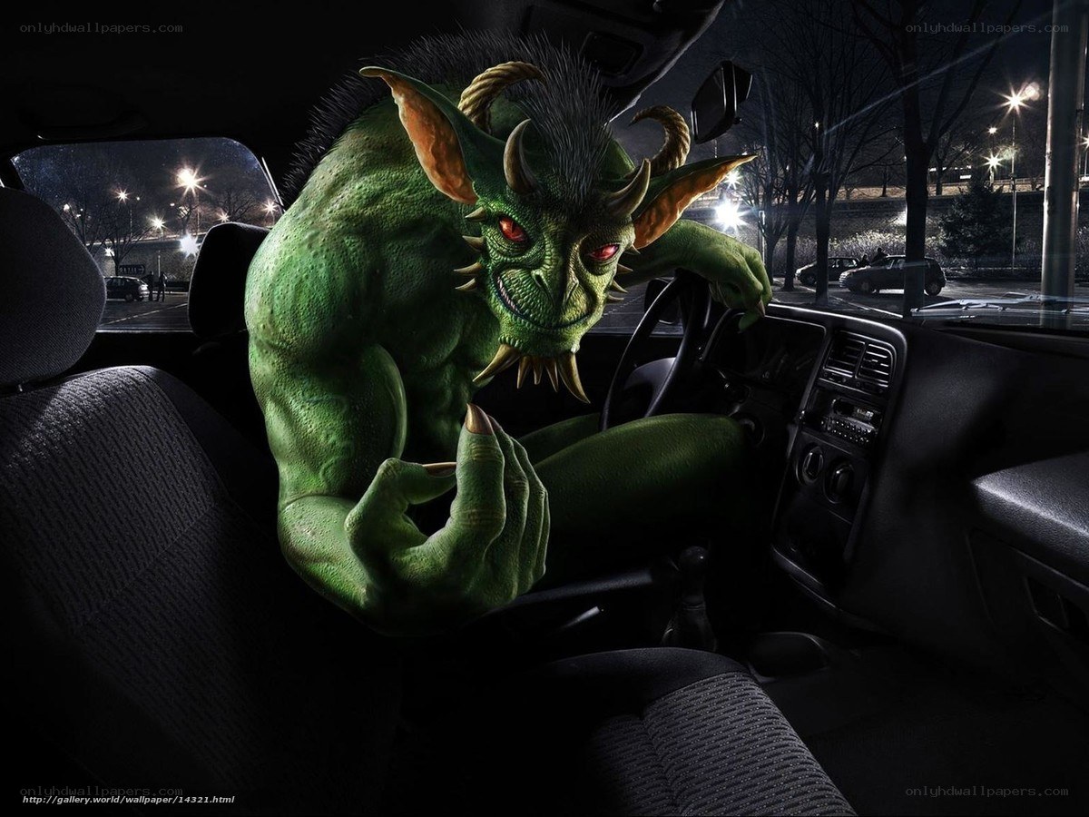Green monster in car at night