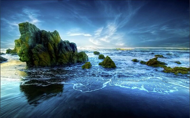 Green Mossy Rocks on Beach — Blue