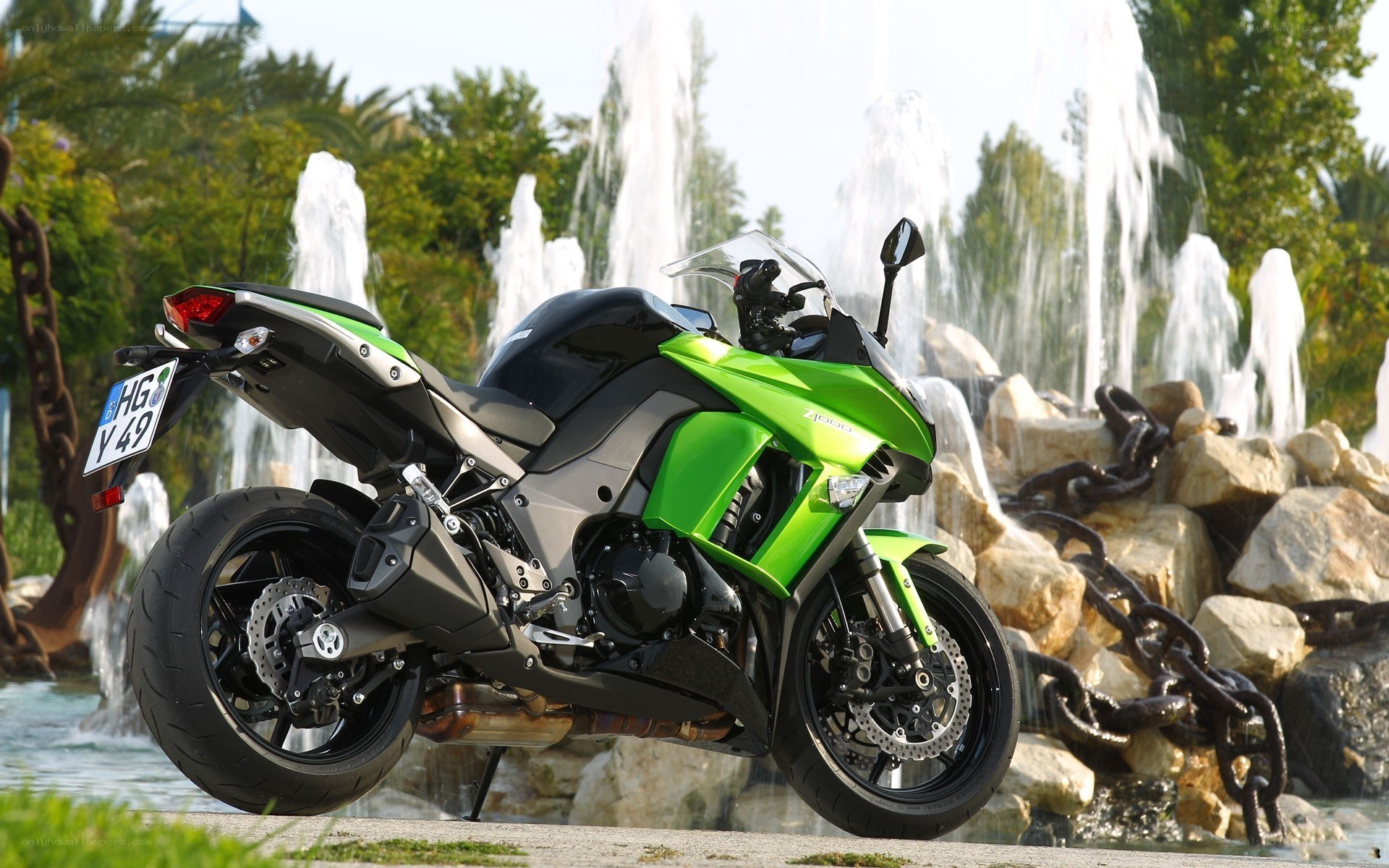 green motorcycle by fountain