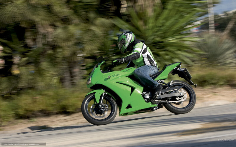Green motorcycle in motion