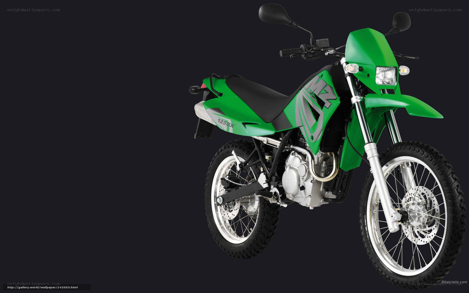 green motorcycle on black