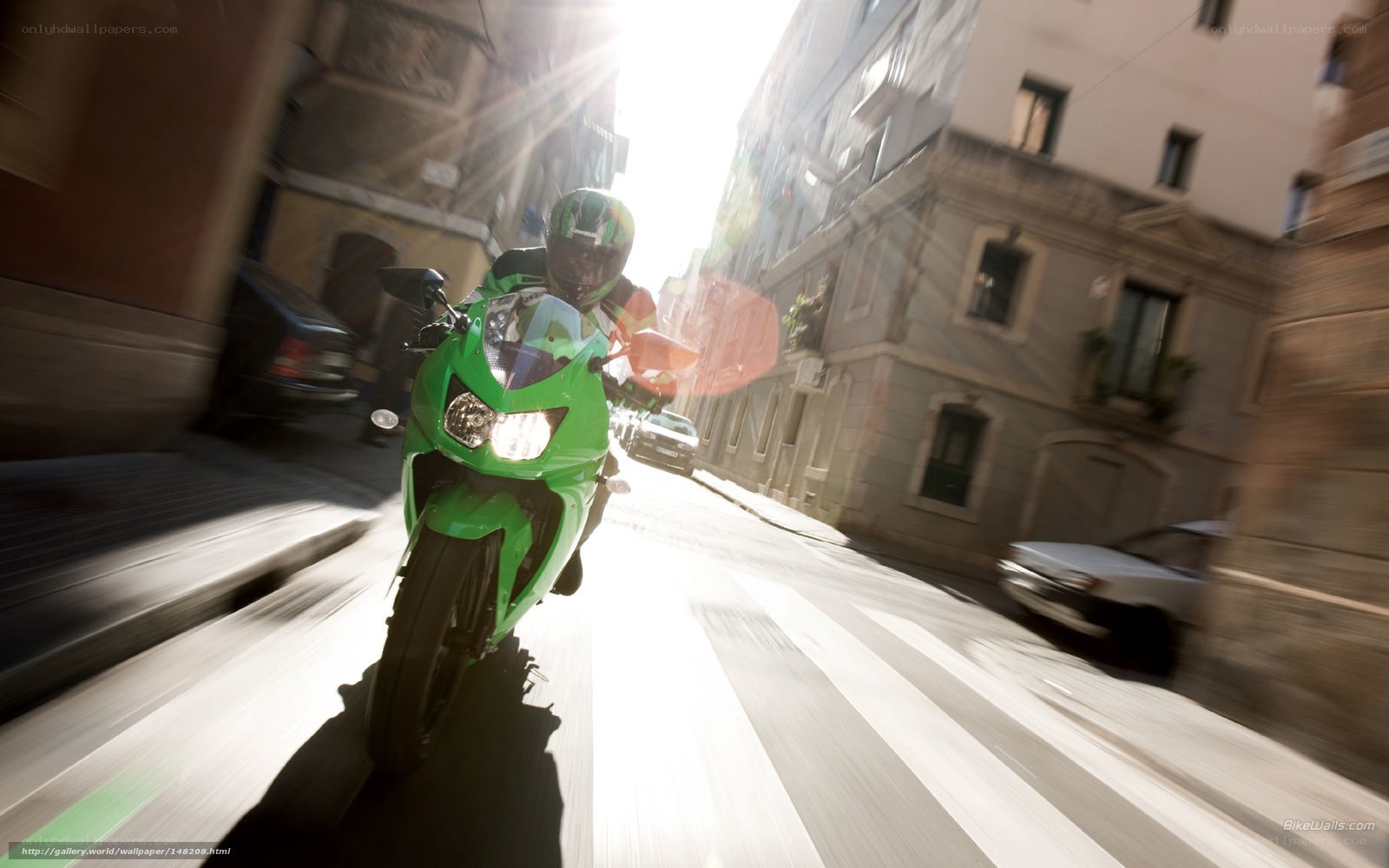 green motorcycle on city street