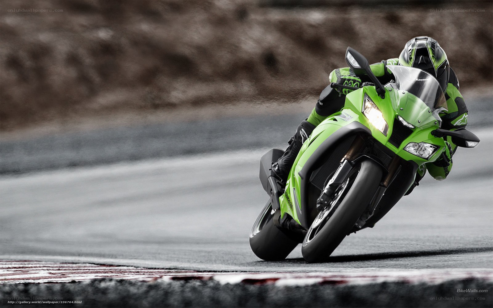 Green motorcycle on racetrack