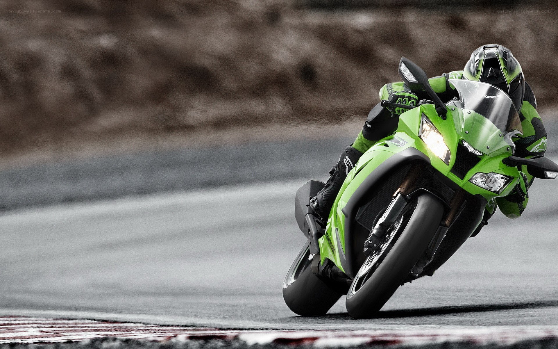 Green motorcycle on racetrack