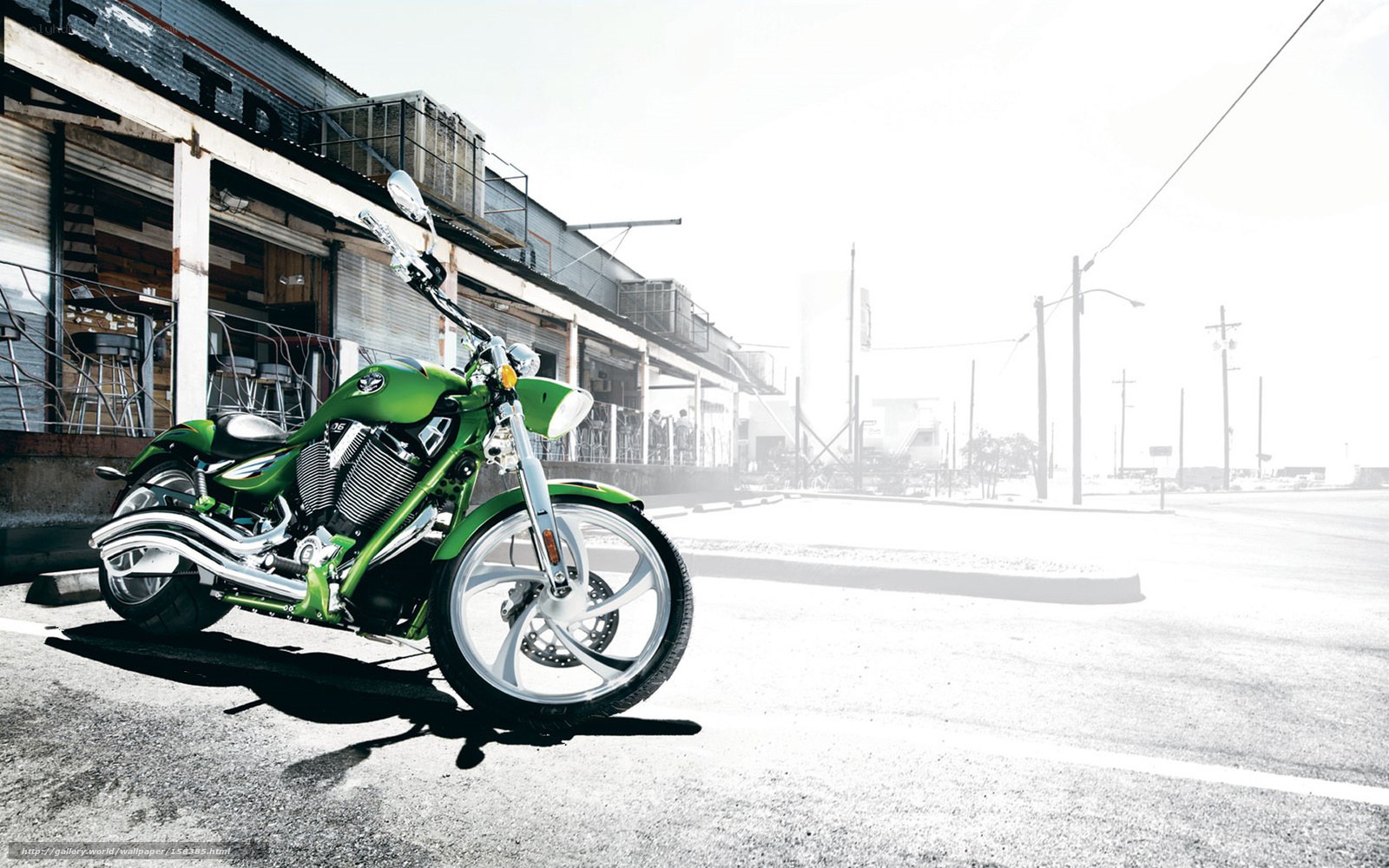 green motorcycle on street