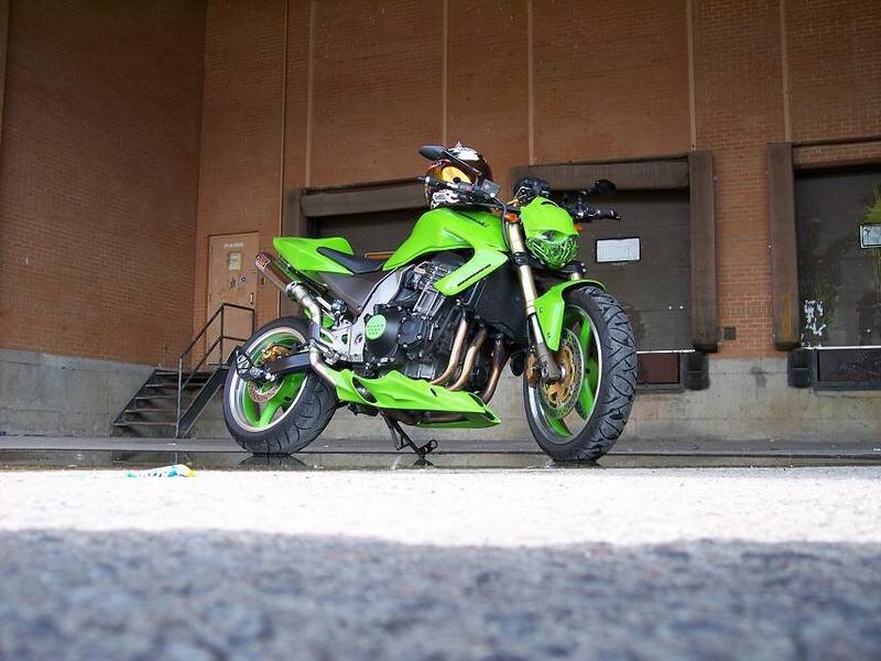 green motorcycle parked outside