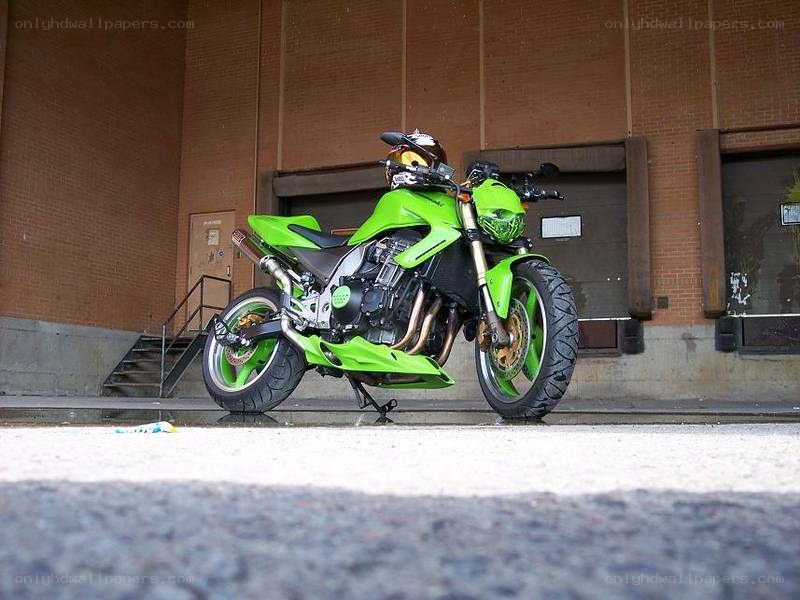 green motorcycle parked outside
