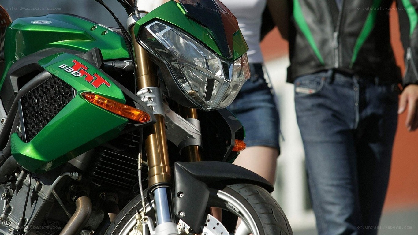 Green motorcycle with riders