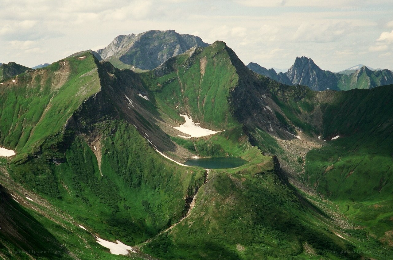 Green mountain lake landscape