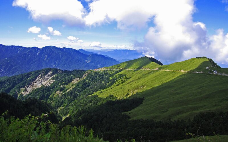 Green mountain landscape with clouds