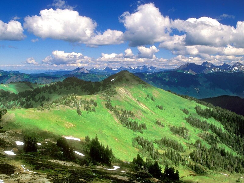 Green mountain landscape with clouds