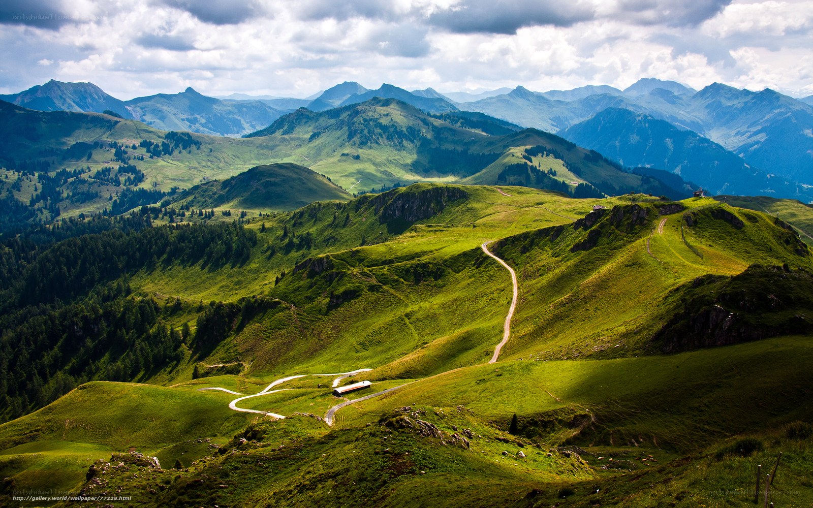 Green mountain landscape with winding roads