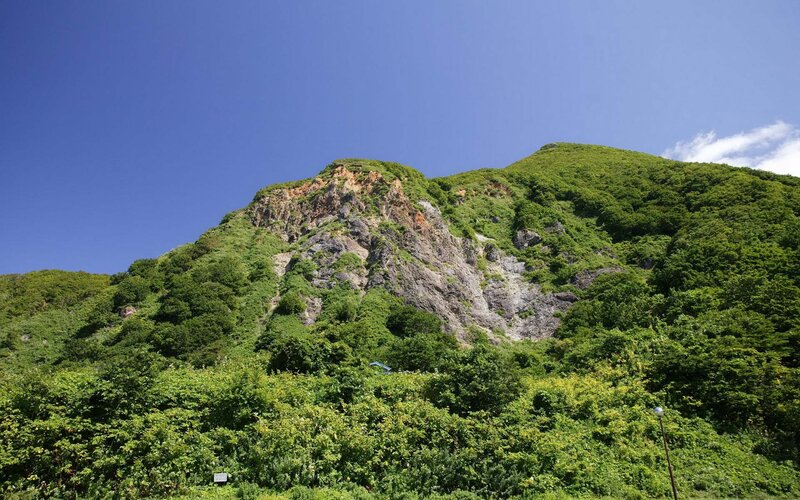 green mountain under blue sky