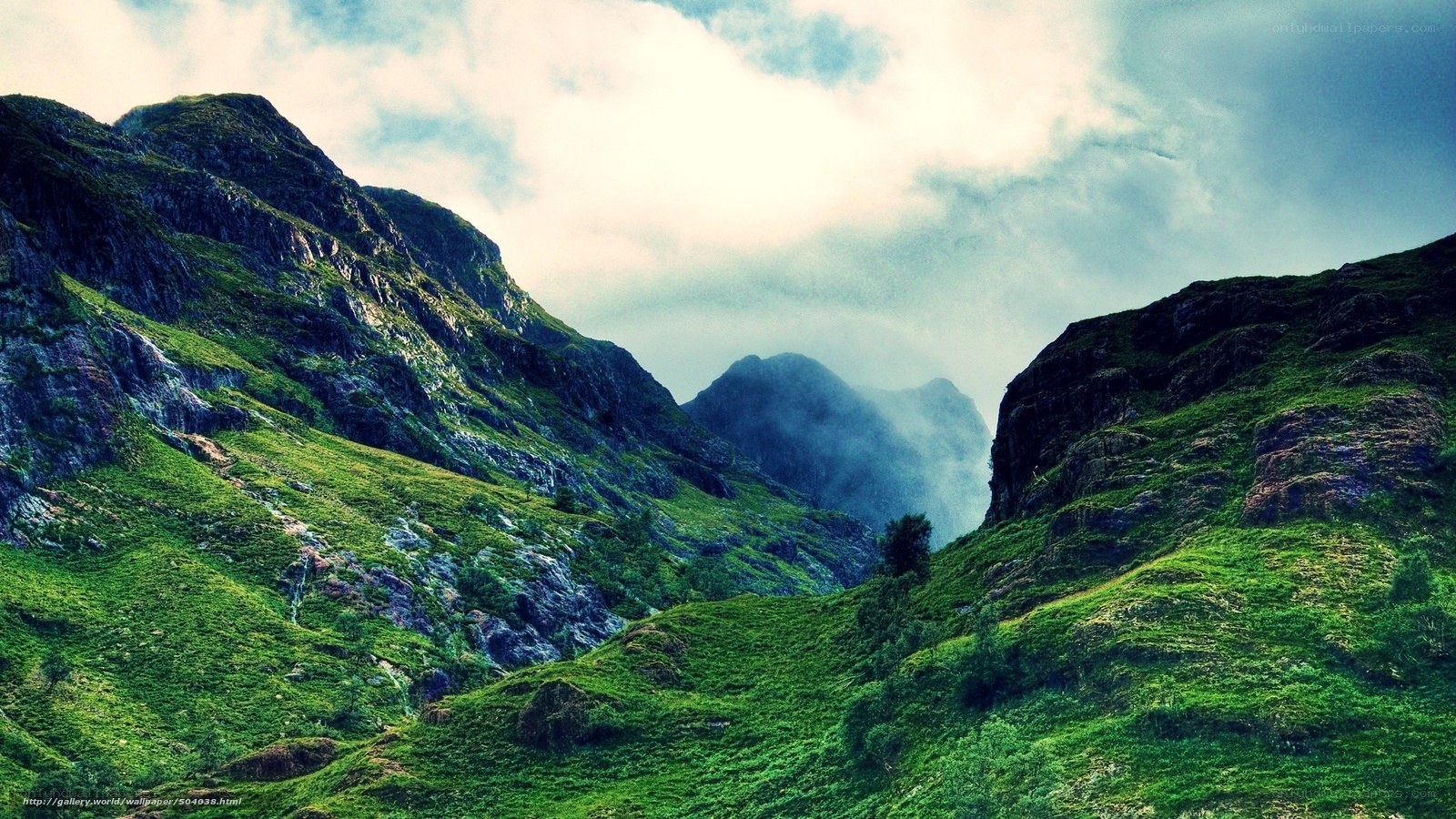 Green mountain valley with mist