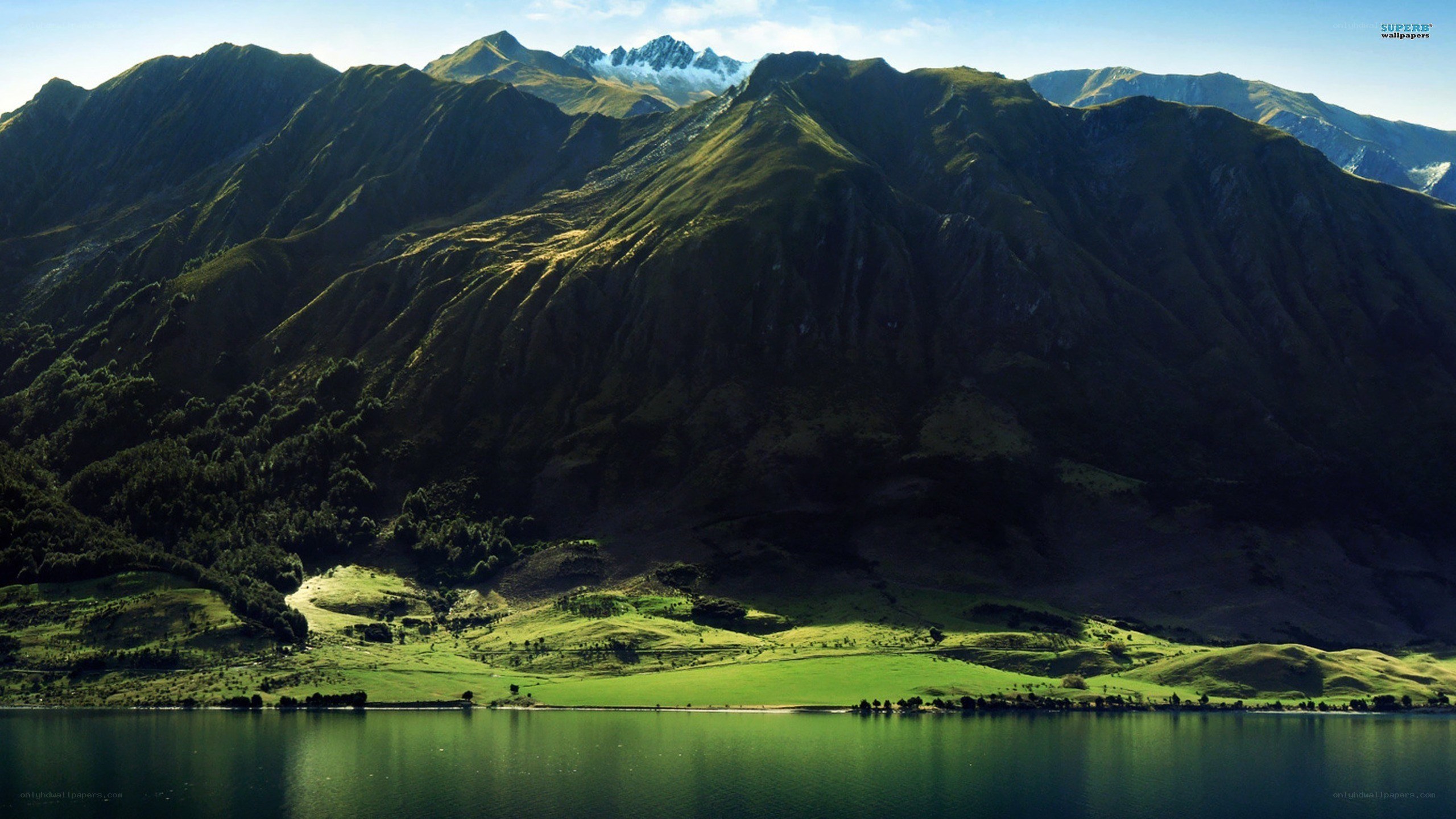 Green mountains and lake landscape
