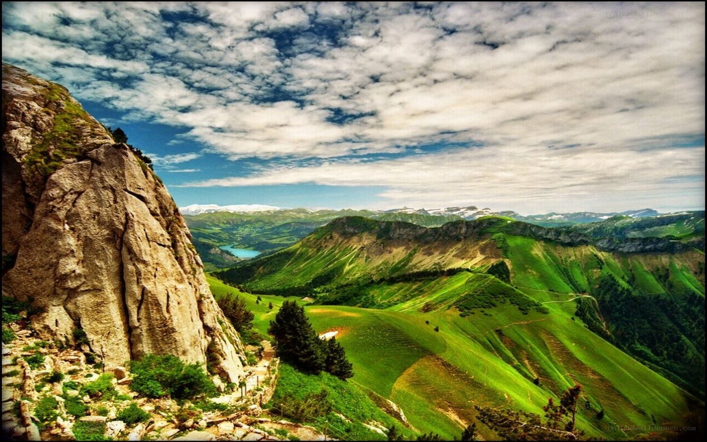 Green mountains and rocky cliff