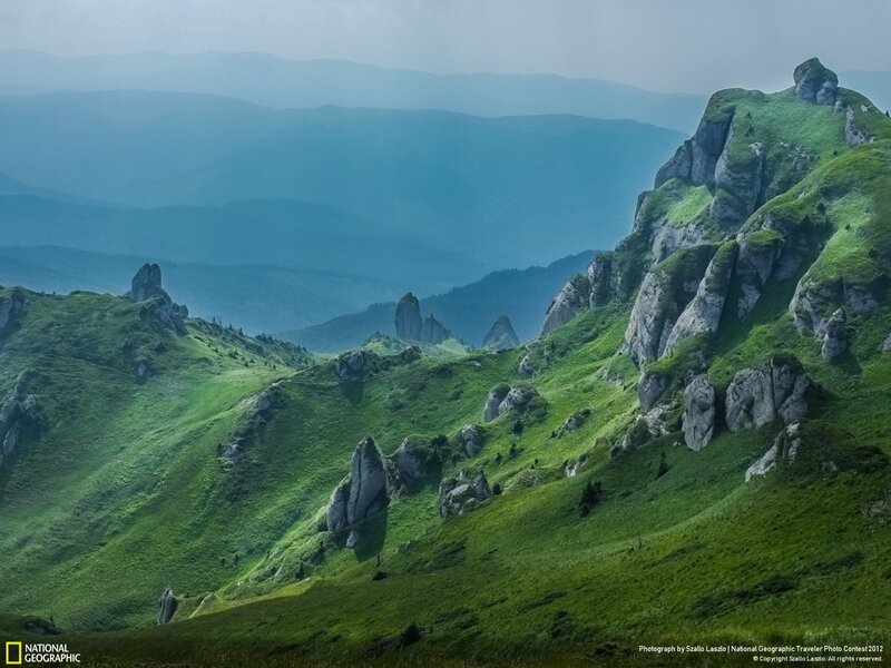 Green mountains in mist