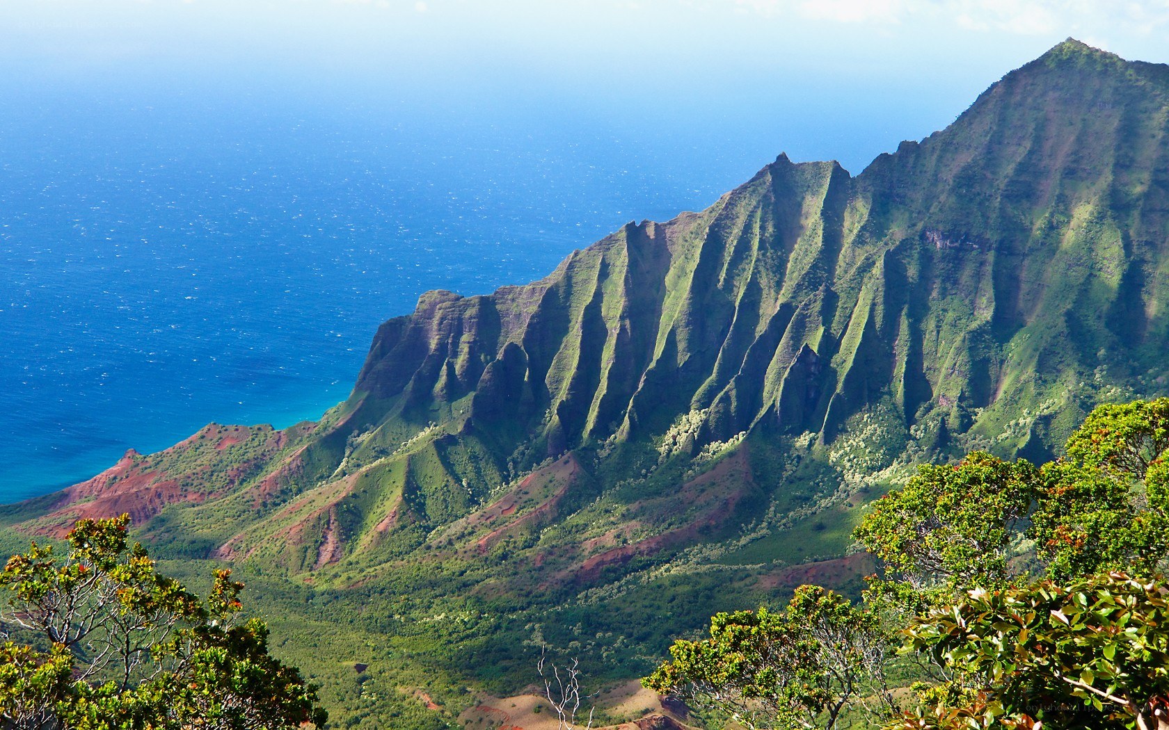 Green mountains overlooking the ocean