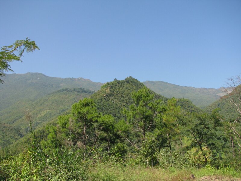 Green mountains under blue sky