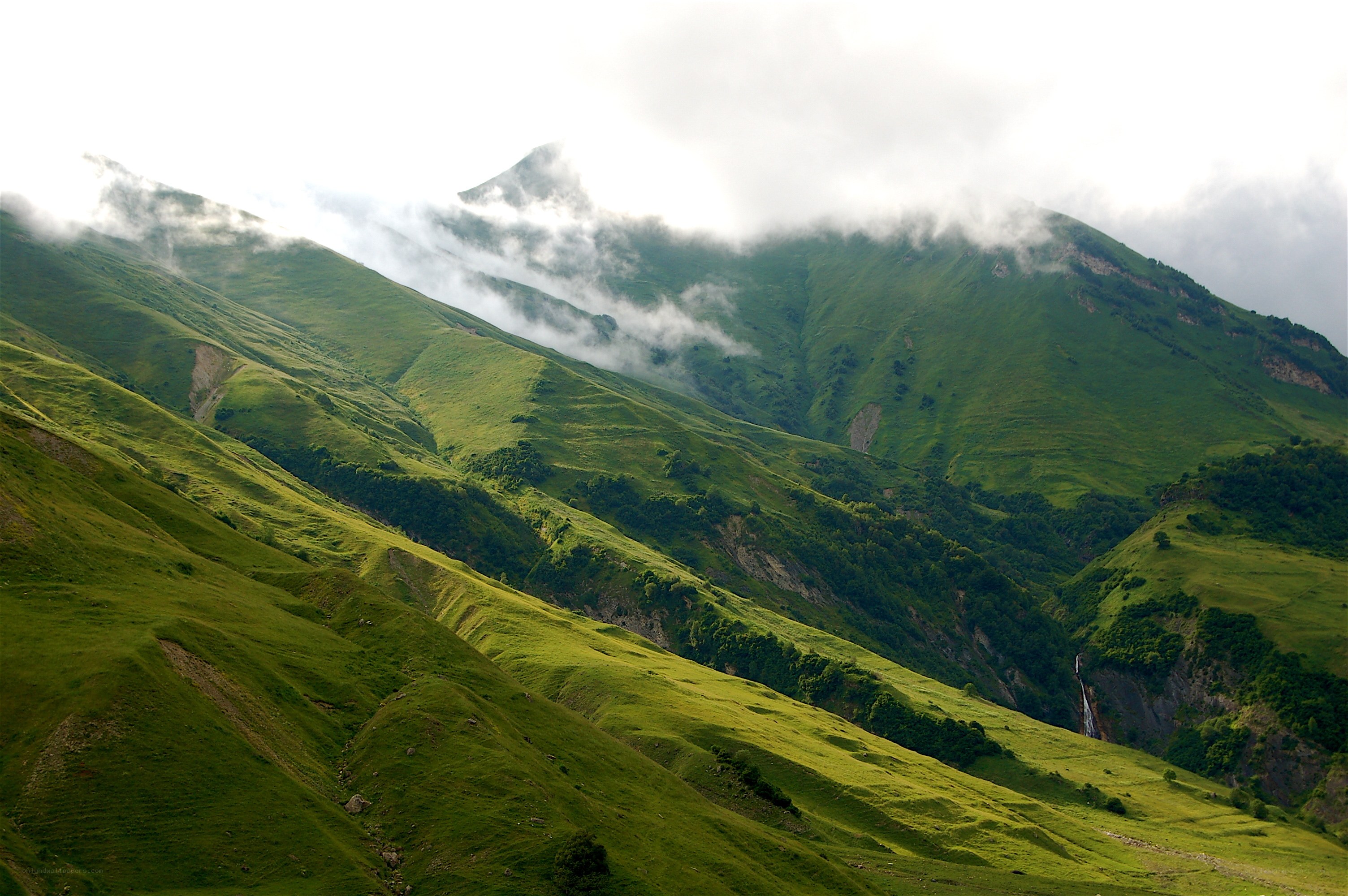 Green mountains with clouds